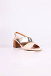 Gold and beige low heels 
sandal on a white background