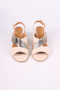 Pair of beige and Gold low heels  open-toe sandals on a white background