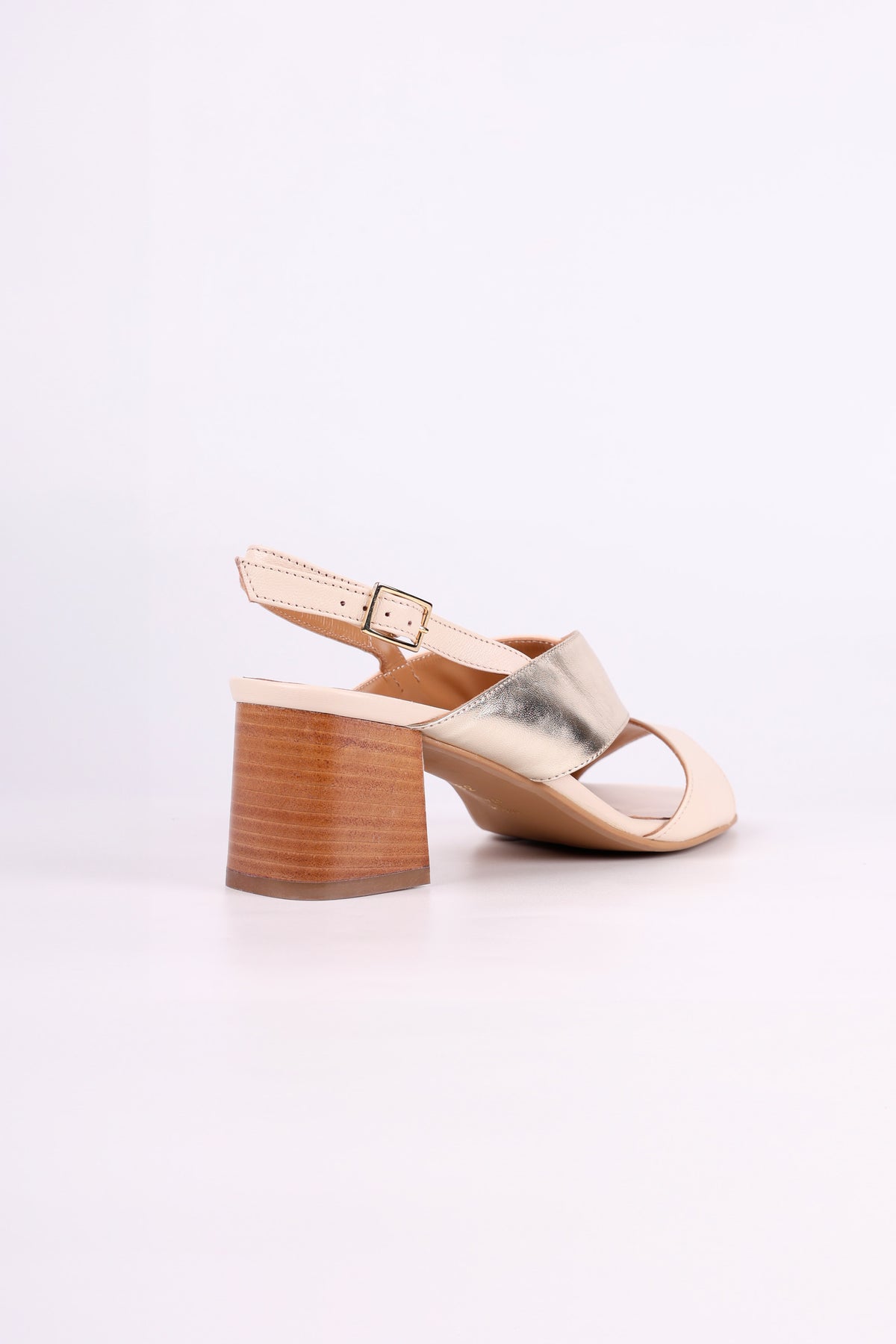 Gold and Beige sandal with wooden block low heel on a white background