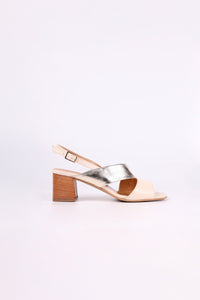 Gold and Beige  sandal with wooden low heel on a light pink background