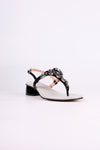 Black sandal low heel with black straps and embellishments on a white background