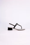 Black sandal low heels with gemstones on a white background