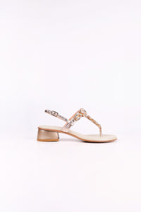 Platinum  sandal low heels with clear straps on a white background