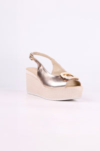 Platinum wedge sandal on a white background