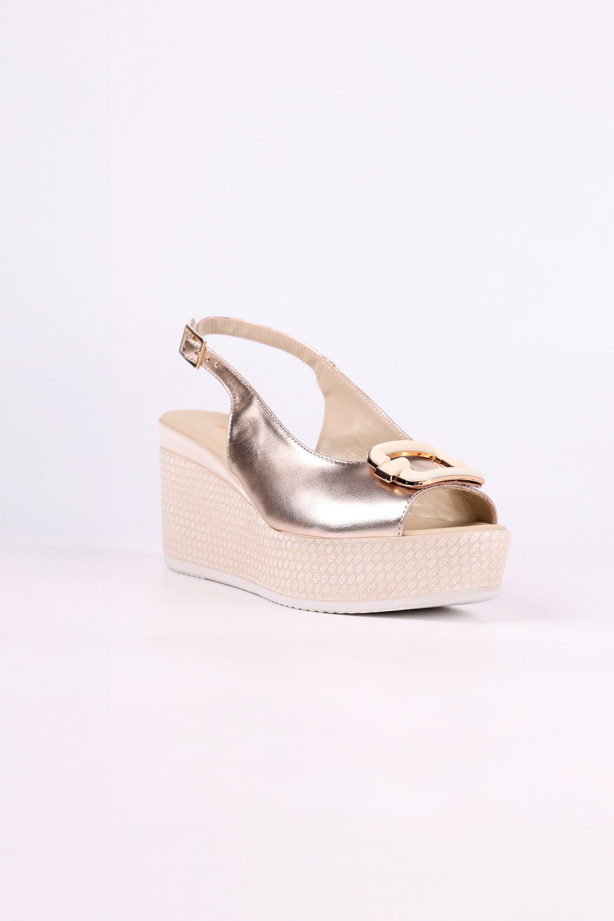 Platinum wedge sandal on a white background