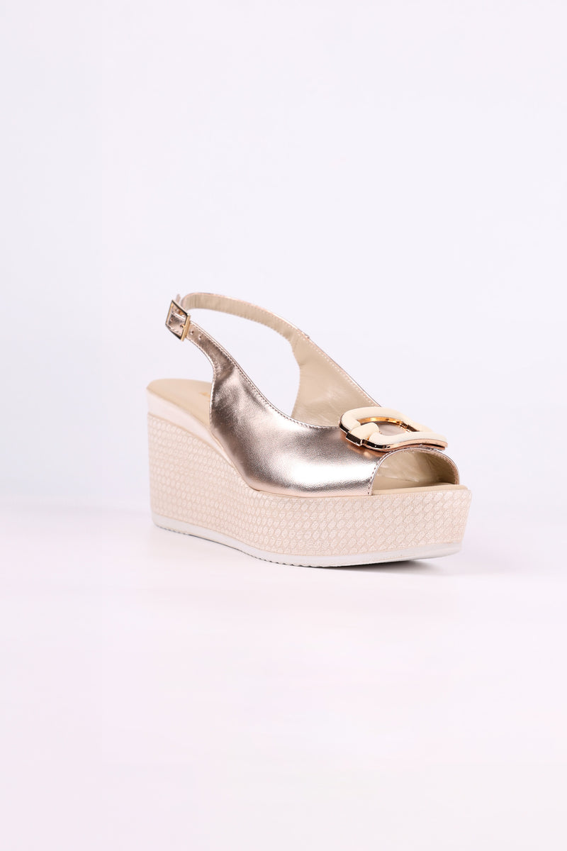 Platinum wedge sandal on a white background