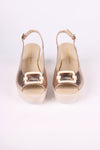 Platinum Wedge sandals with metallic buckle on a white background