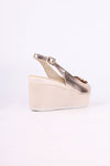Platinum wedge sandal on a white background