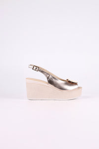 Platinum wedge sandal on a white background