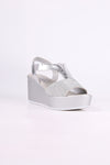 Silver wedge sandal on a white background