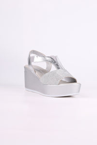 Silver wedge sandal on a white background