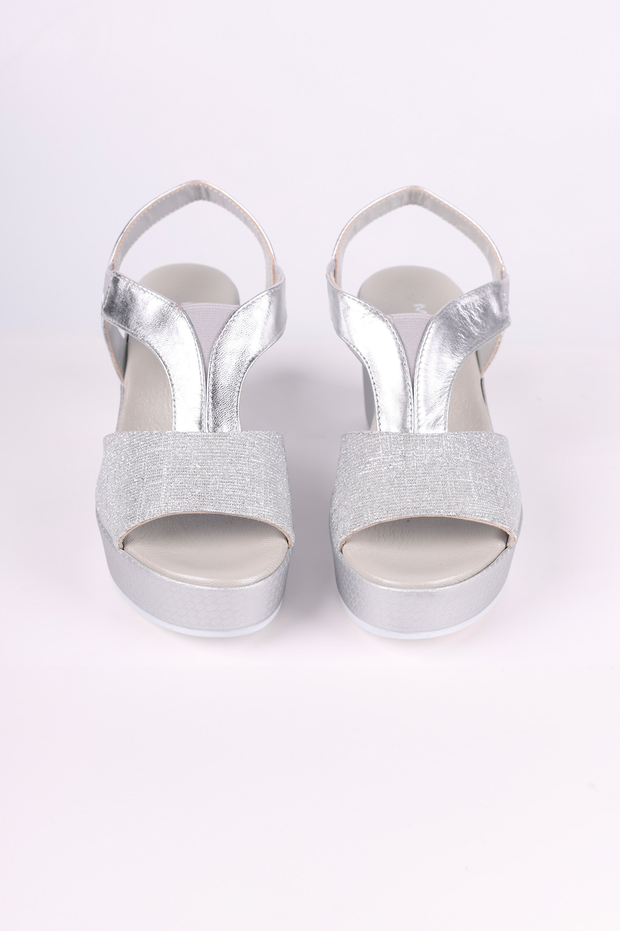 Silver glitter high heels on a white background