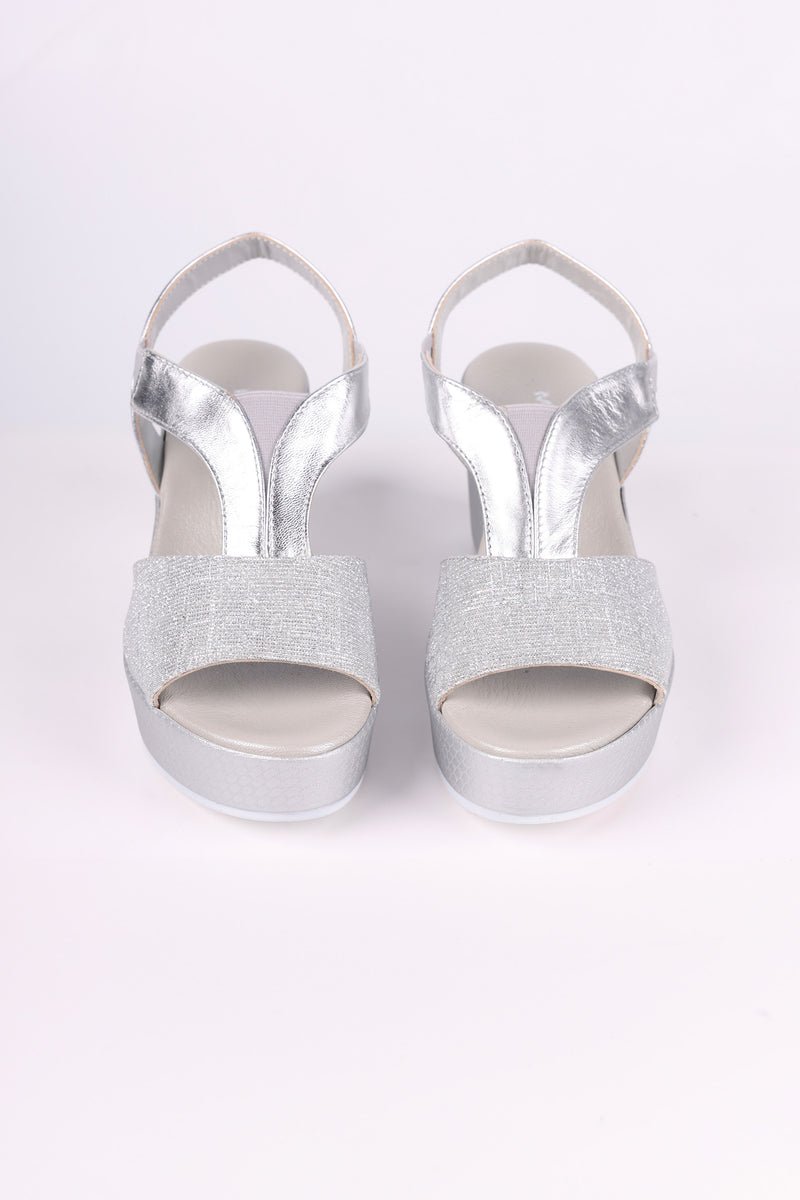 Silver glitter high heels on a white background