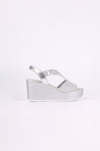 Silver wedge sandal on a white background