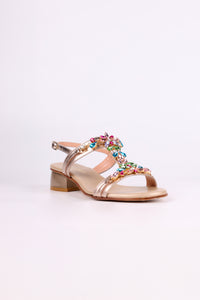 Platinum sandal low heels with colorful embellishments on a white background