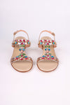 Platinum sandals low heels with colorful gemstones on a white background