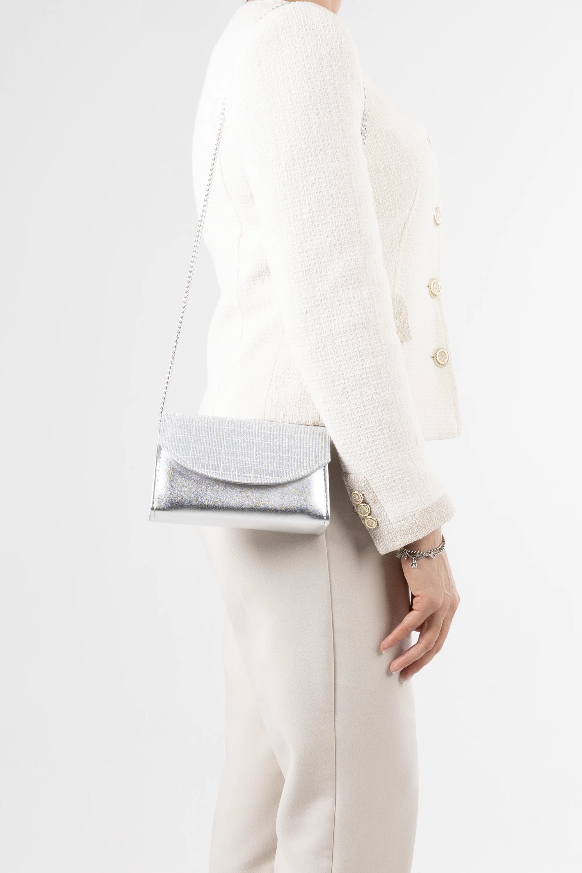 Stella Silver Metallic & Glitter Clutch. Italian vegan leather with 2 interchangeable straps: silver chain and glitter handle. Made in Italy.